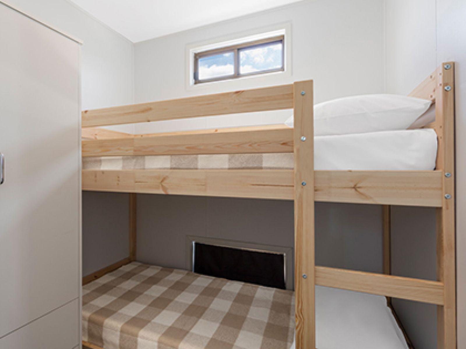 Room with two bunk beds in a standard cabin at RACV Cobram Resort.