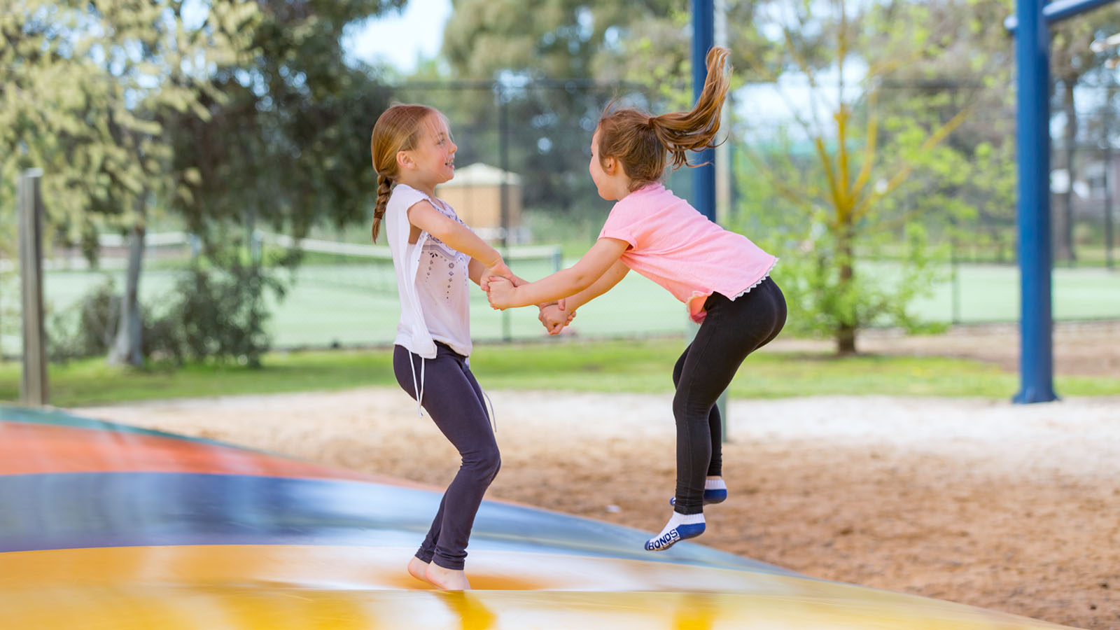 Two girls enjoying the jumping pillows at the Cobram resort. 