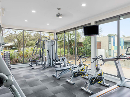 Gym with multiple machines and exercise items at RACV Cobram Resort.