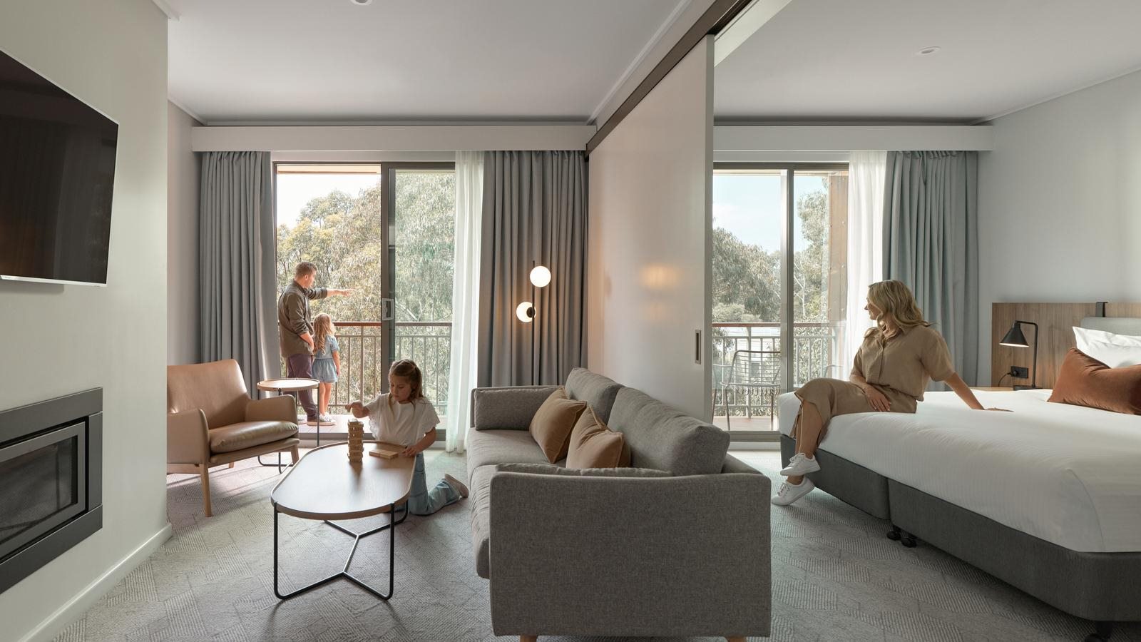 A family enjoying their 2 bedoom, 2 bathroom suite at Goldfields.
