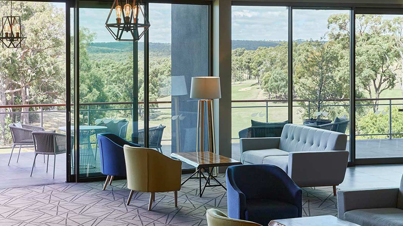 Couches, seats and tables in RACV Goldfields Resort's terrace.