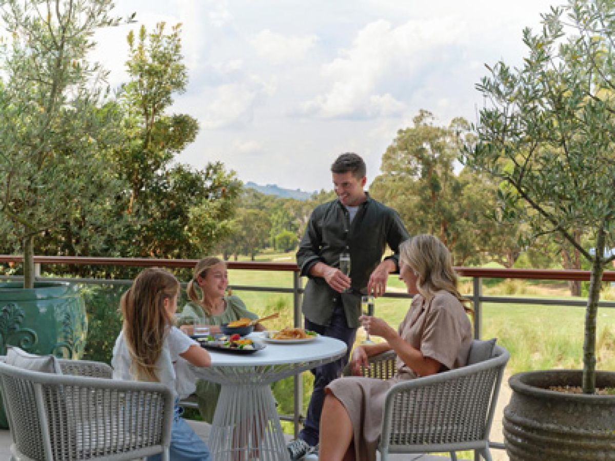 Family enjoying a meal together at Goldfields Resort.