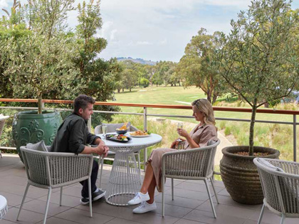 A couple sitting and talking at Springs Bar 