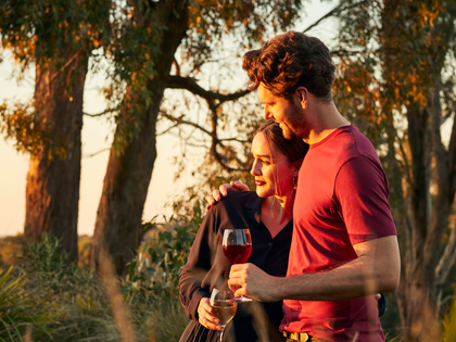Couple enjoying some wine in the bushland near Goldfields. 