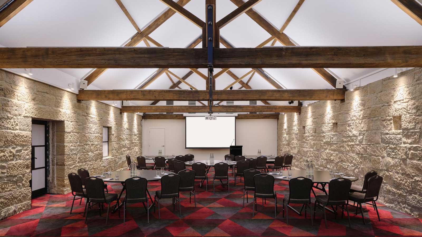 The stables room set up cabaret style.