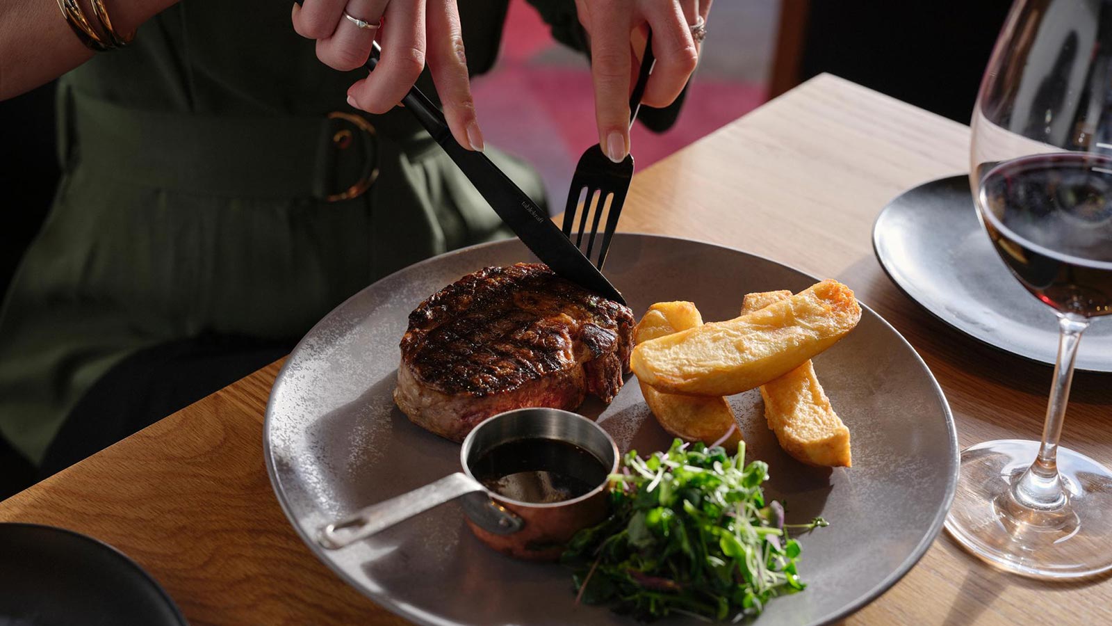 Steak, thick cut chips, greens and gravy at RACV Hobart Hotel's Charcoal restaurant.