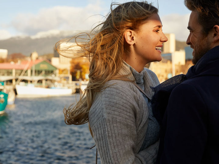 Couple standing by the water in Hobart