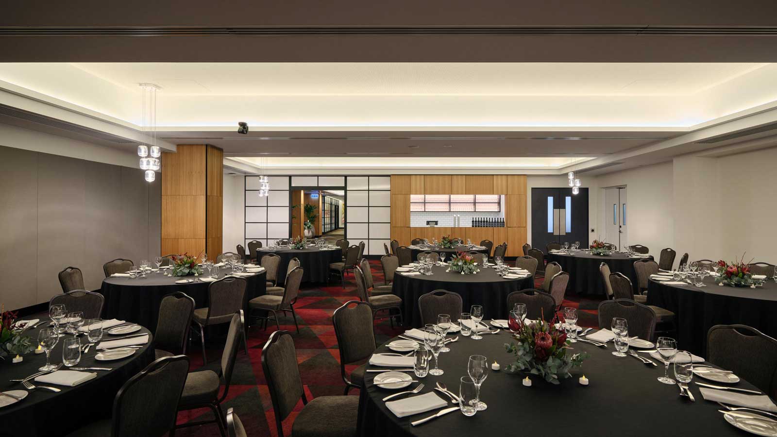 Collins room set up for a wedding dinner service. 