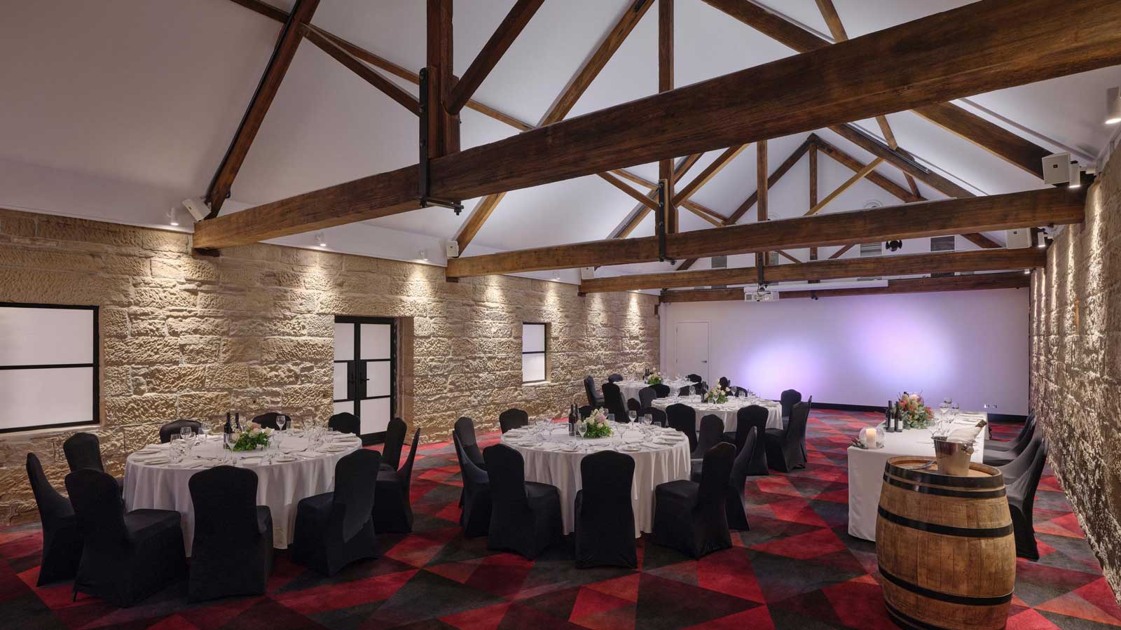 The Stables set up for a wedding dinner service. 