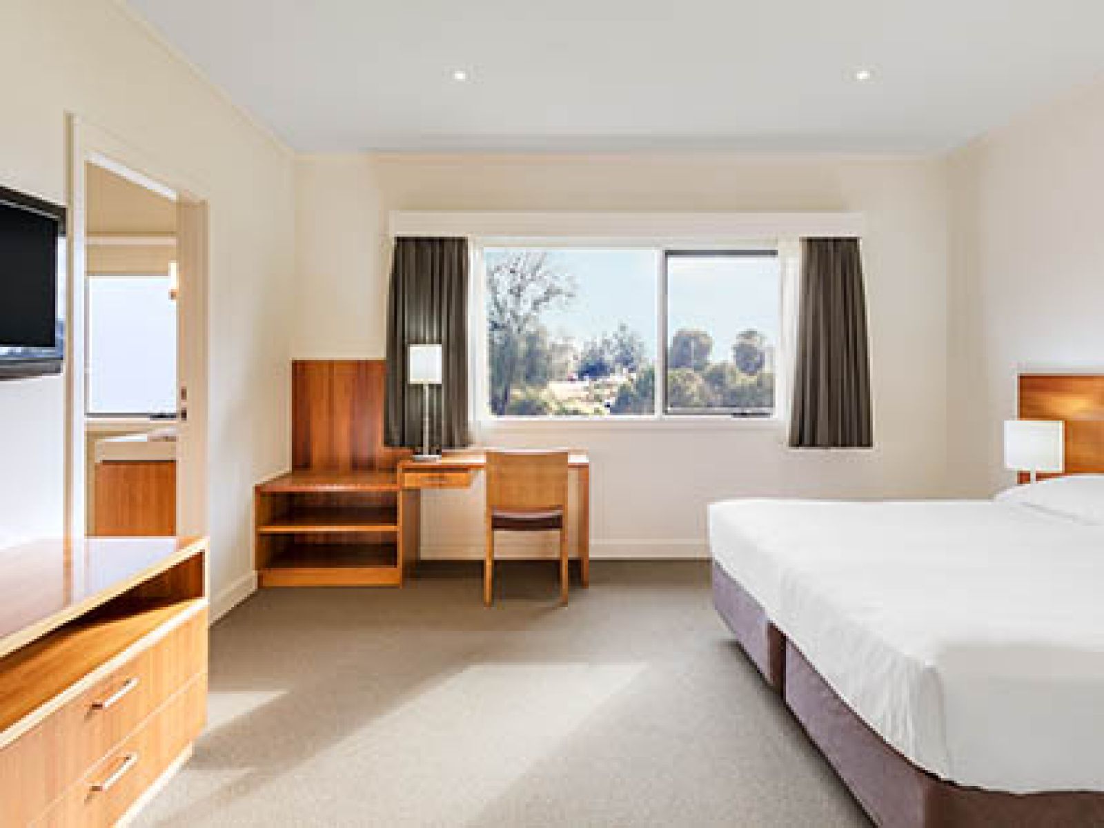 Bedroom and bathroom in Premium 2-bedroom Villa at RACV Inverloch resort.