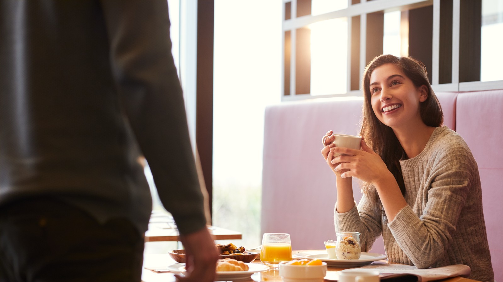 Woman having breakfast at Radius in Inverloch