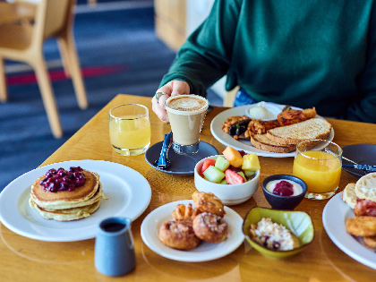 An array of breakfast foods spread on a table