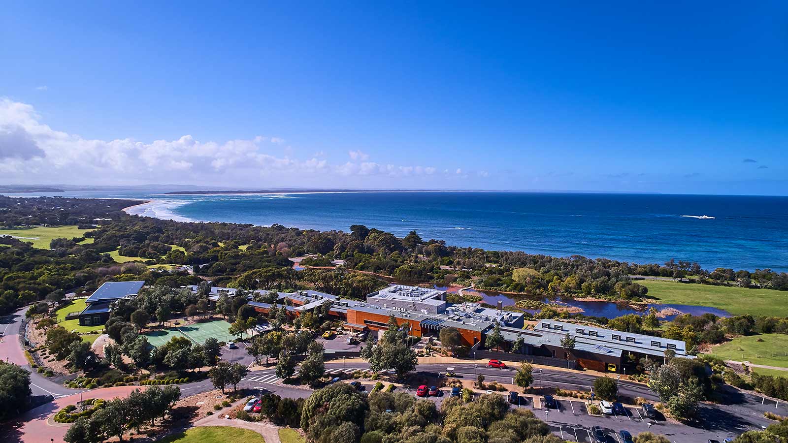 RACV Inverloch Resort during the day, near the ocean.
