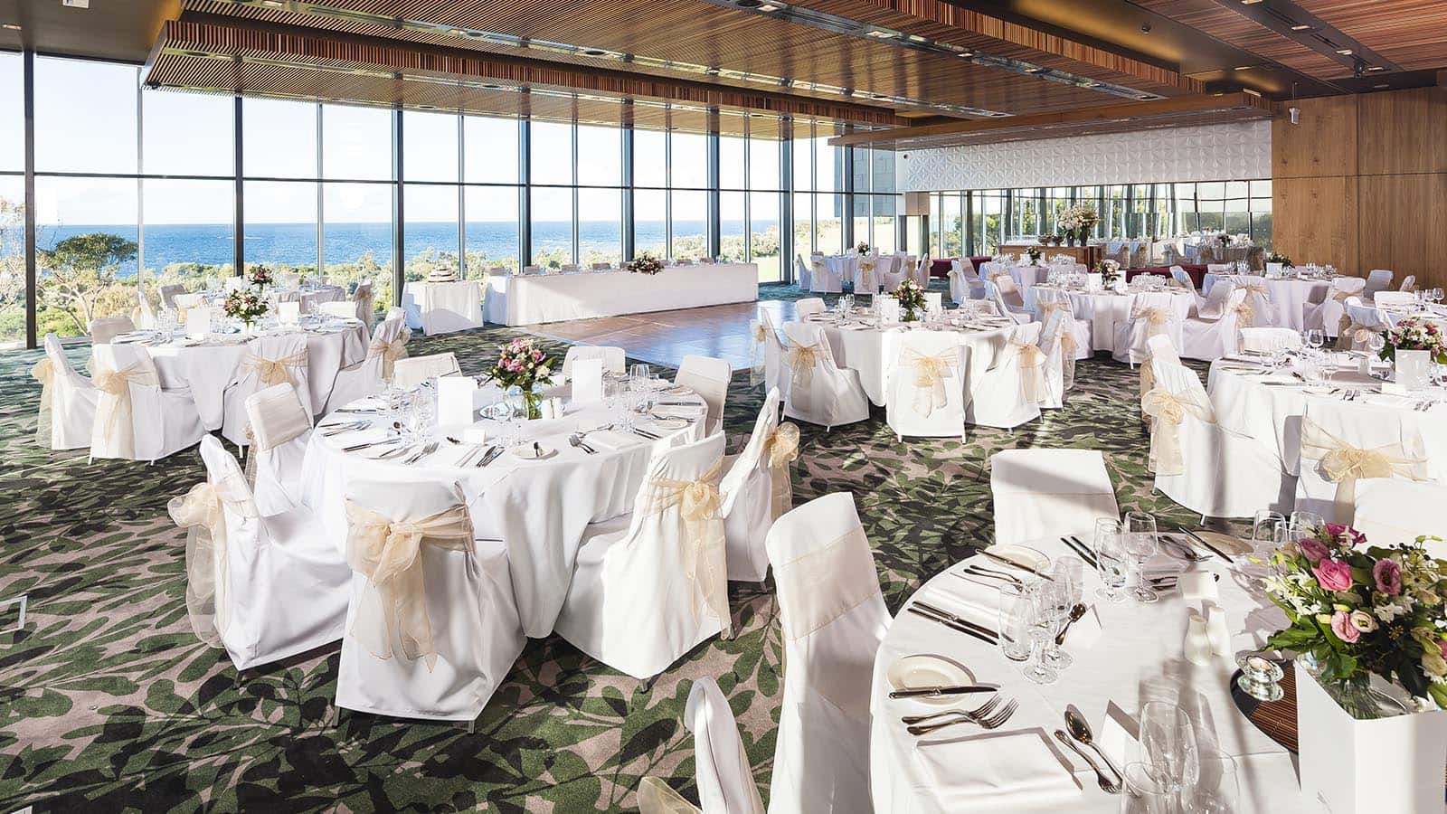 Panorama ballroom at RACV Torquay resort set up for wedding banquet.