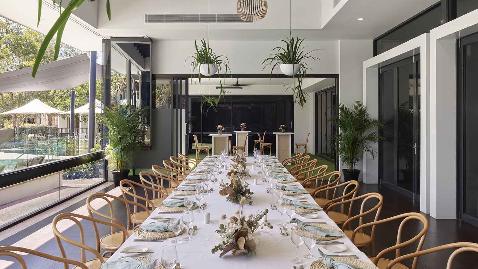 RACV Noosa Resort Acuri Terrace dinner set up with long table.