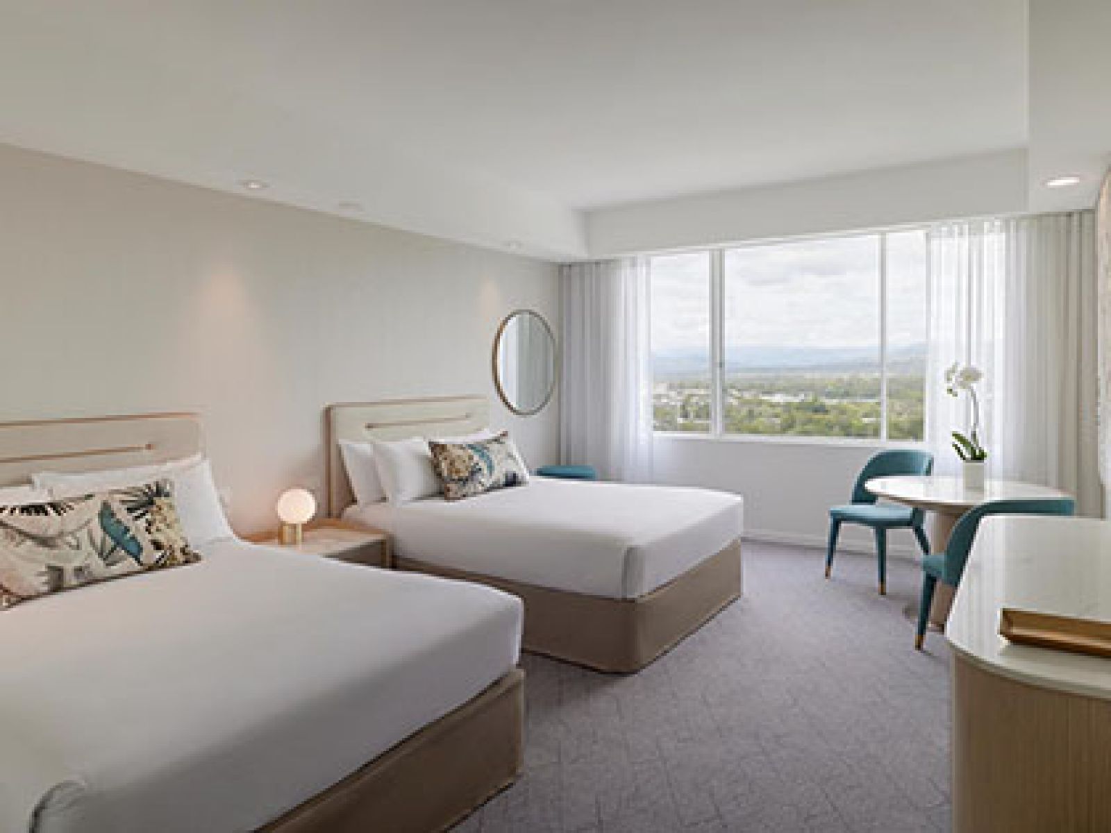 Mountain View Room at RACV Royal Pines, featuring 2 double beds, TV and seating area.