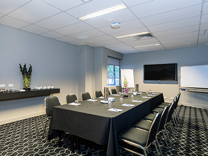 Waratah room at RACV Royal Pines Resort, set up boardroom style.