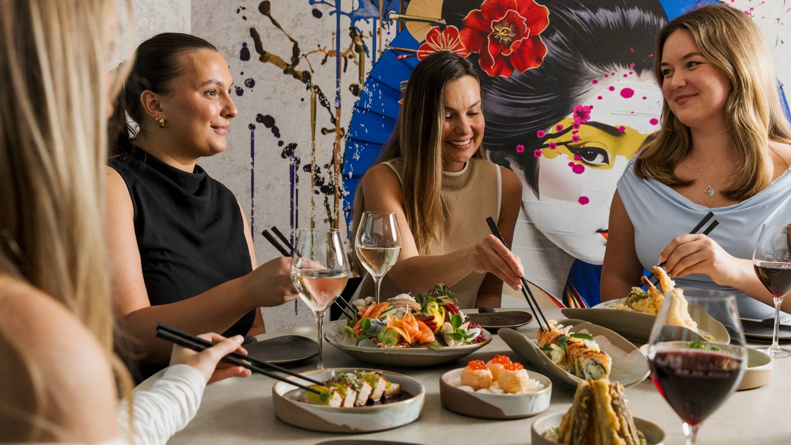 Group of friends eating Japanese food