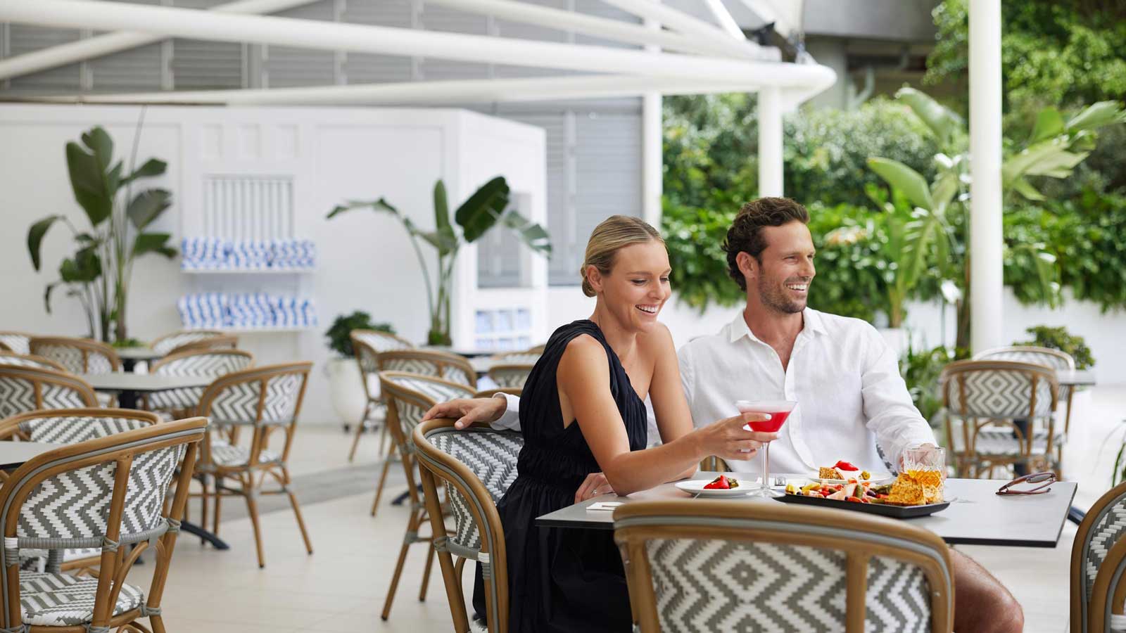 Couple dining together outdoors at RACV Royal Pines