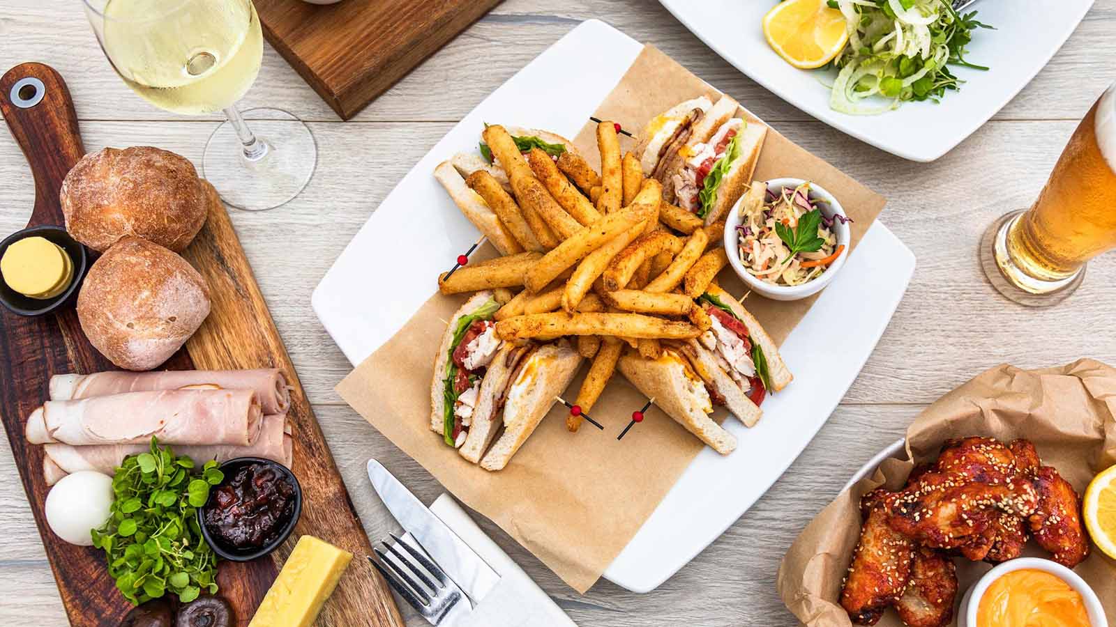 Flatlay shot of a variety of RACV Royal Pines Tees' Clubhouse menu.