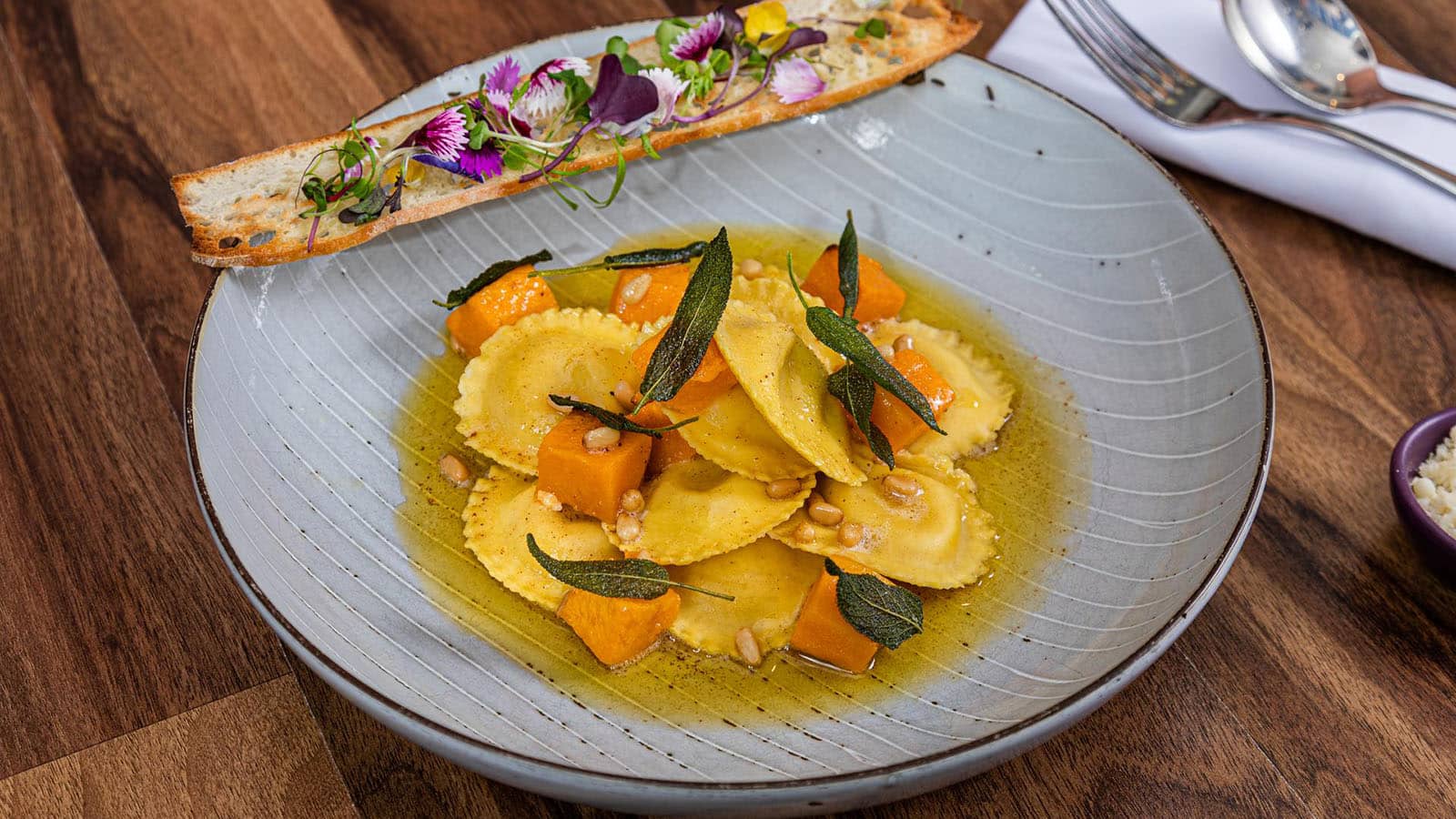 RACV Royal Pines Trattoria Amici's plated dish of pumpkin ravioli pasta.
