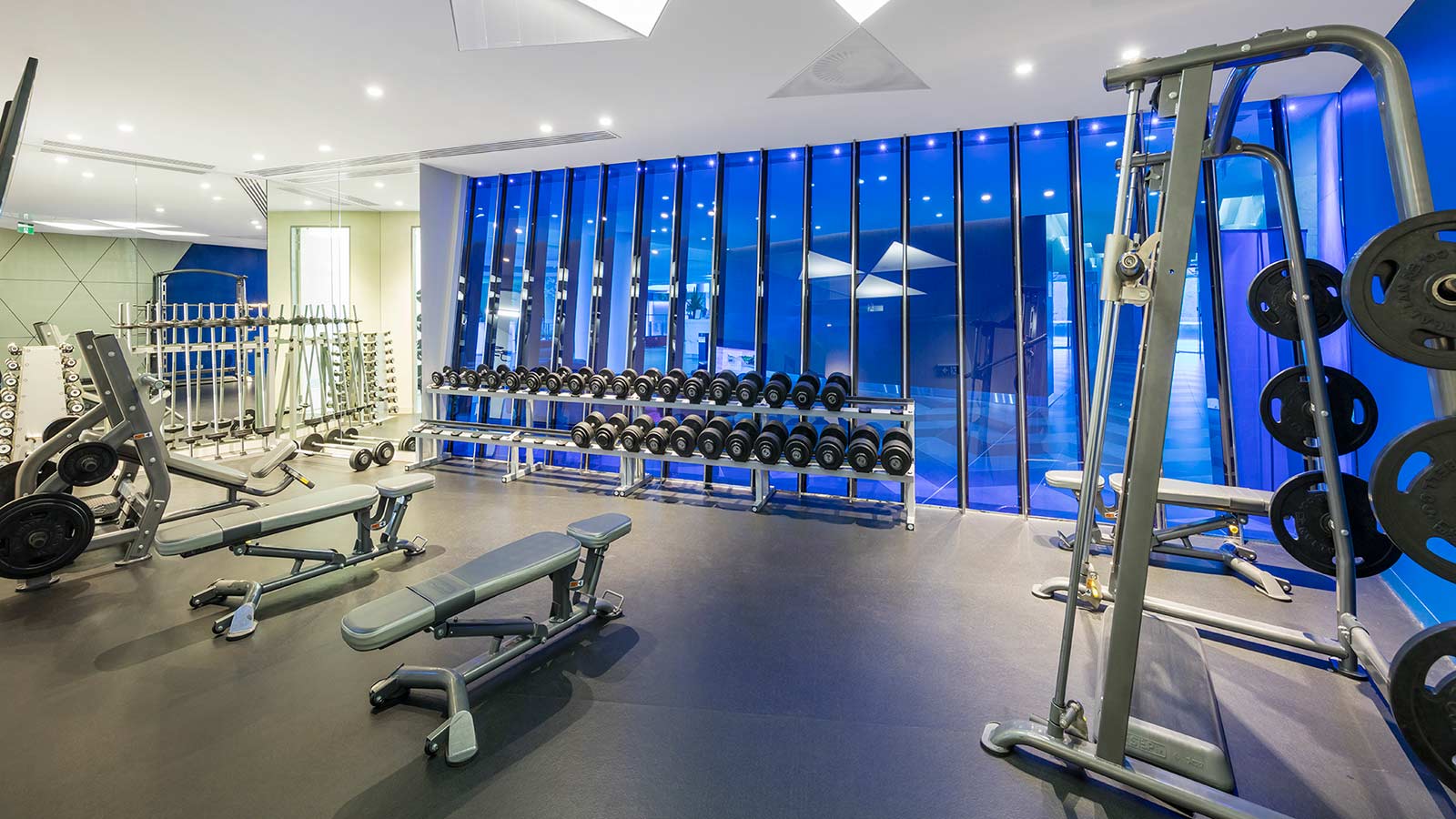 Fitness centre at RACV Royal Pines Resort, featuring weights and gym equipment.