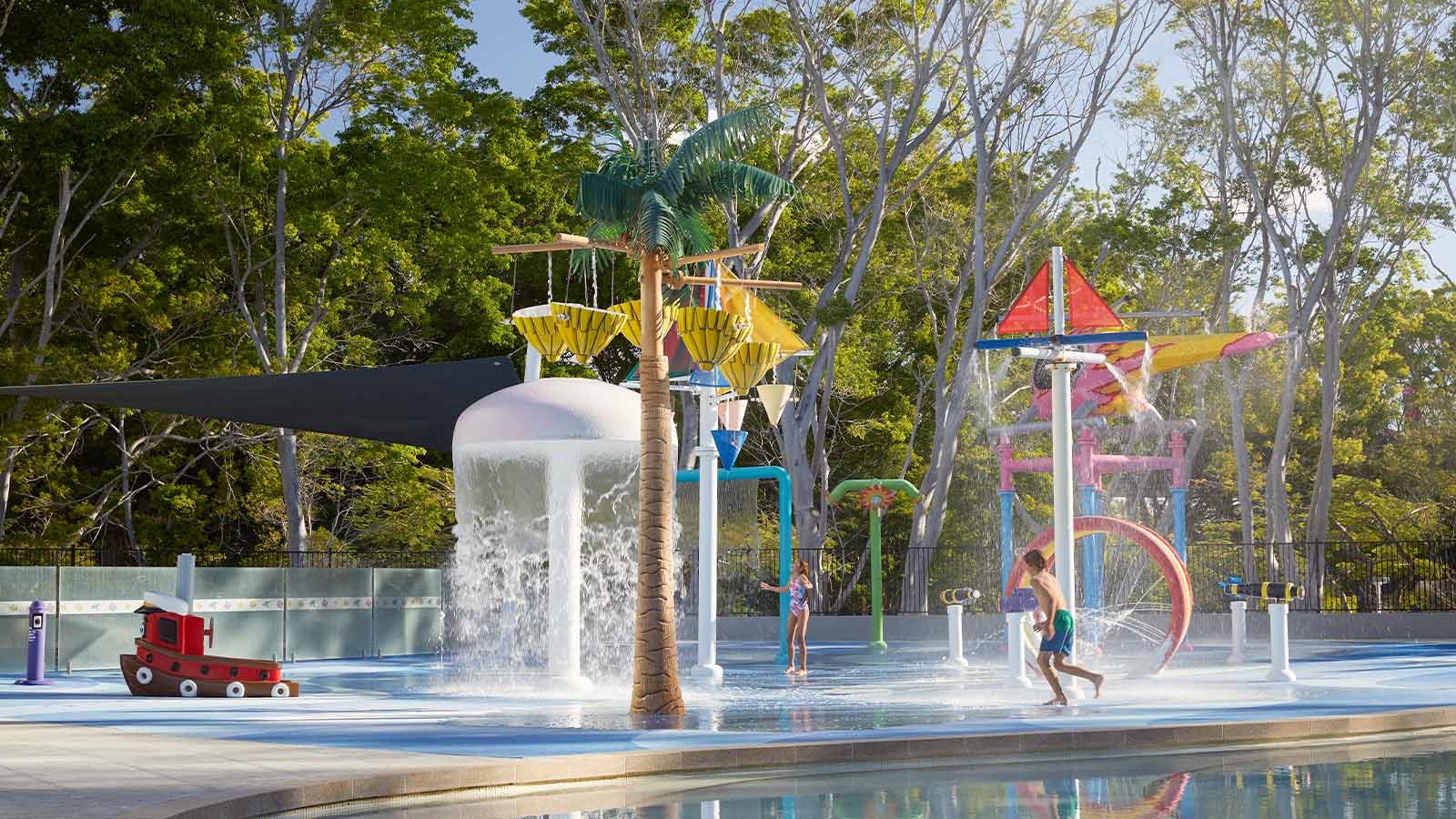 Child running through the Royal Pines waterpark.