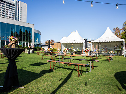 Tents and benches on the lawn area outside RACV Royal Pines Resort.