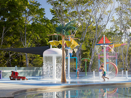 Child running through the Royal Pines waterpark.