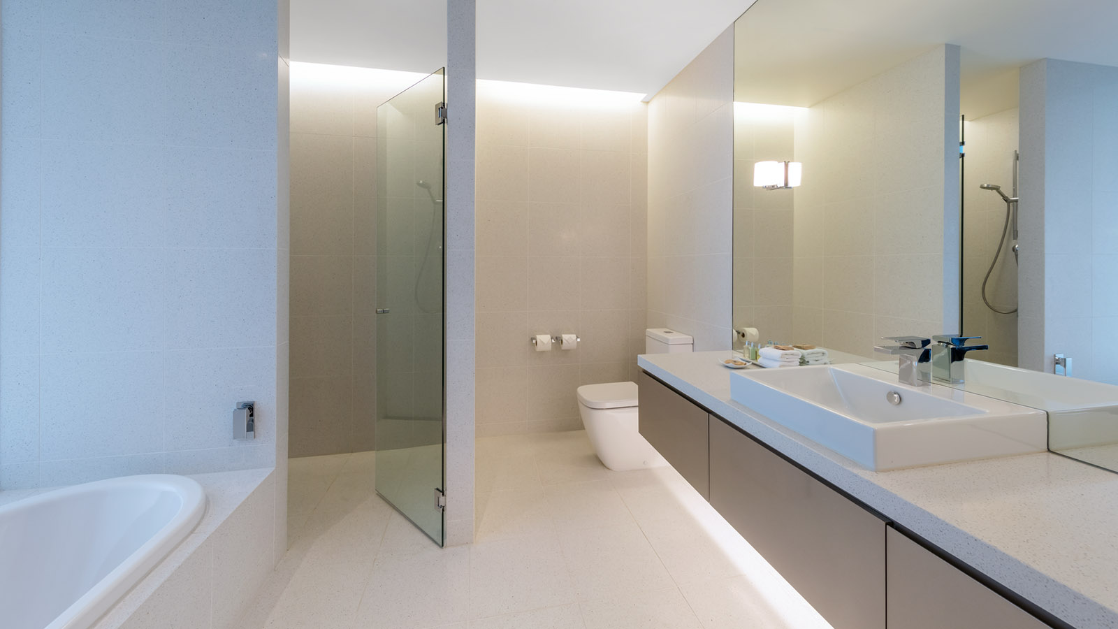 Bathroom with bathtub and shower in Ocean and Golf View room at RACV Torquay Resort.