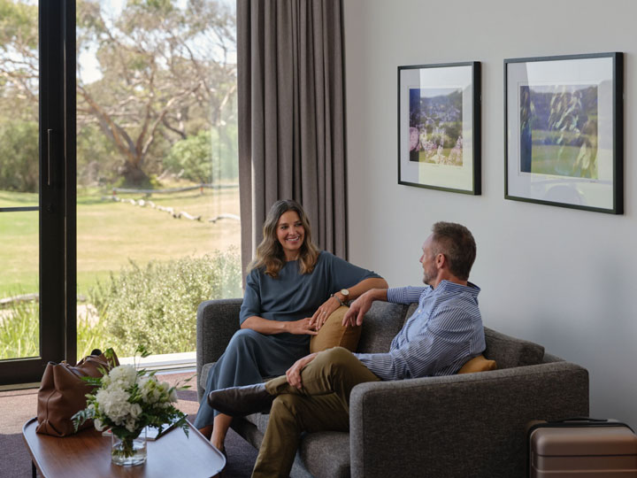 Couple sitting together in golf view room