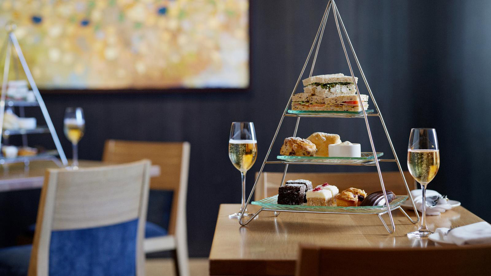 Display of afternoon tea food and sparkling wine at Hardings Lounge at RACV Torquay Resort.