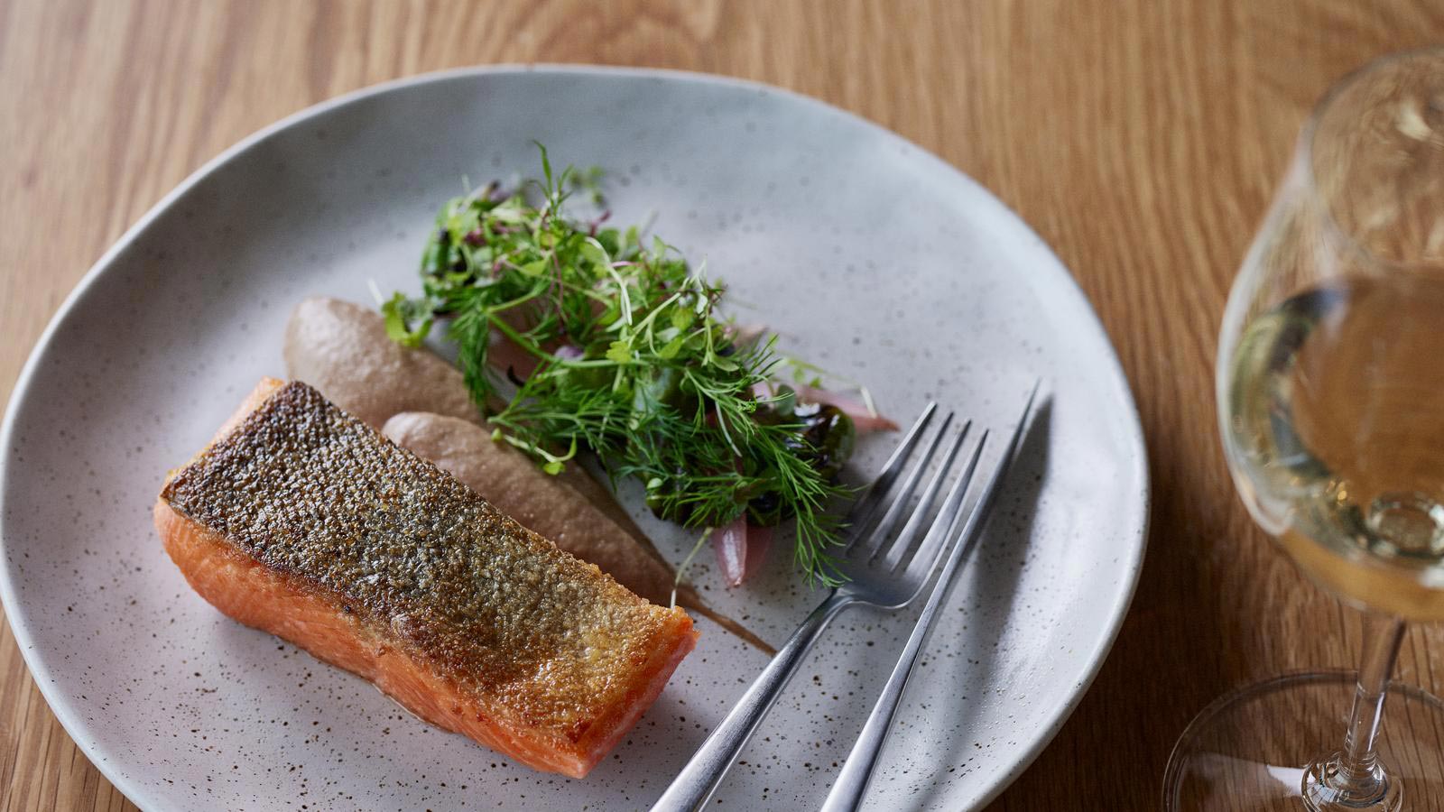 Salmon and greens dish plated at RACV Torquay Number One restaurant.