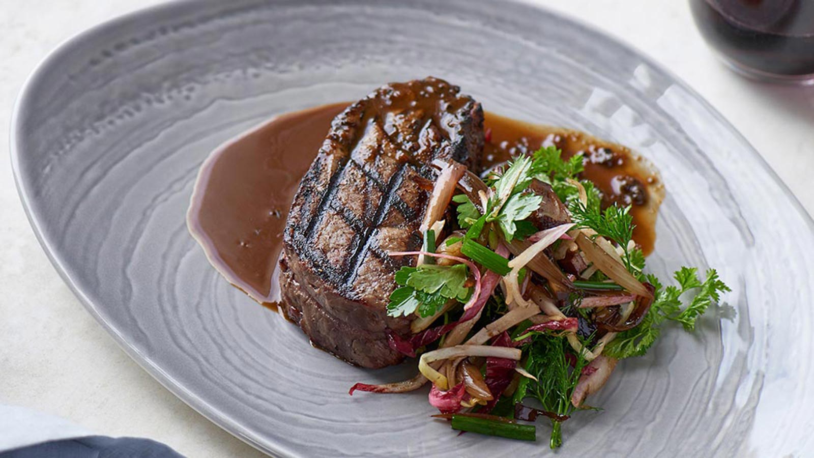 Steak meal plated at RACV Torquay Resort's White's Paddock restaurant.