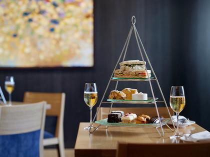 A high tea tower with wine.