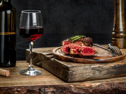 steak paired with a glass of wine