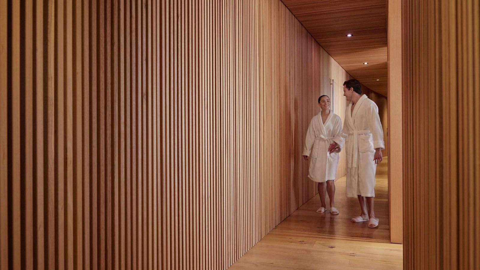 Couple walking through the corridor at RACV Torquay One Spa.