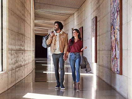 Couple walking through hallway at RACV Torquay Resort.