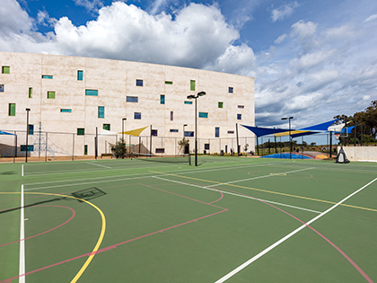 Outdoor courts at RACV Torquay Resort, marked up for a tennis match or basketball game.