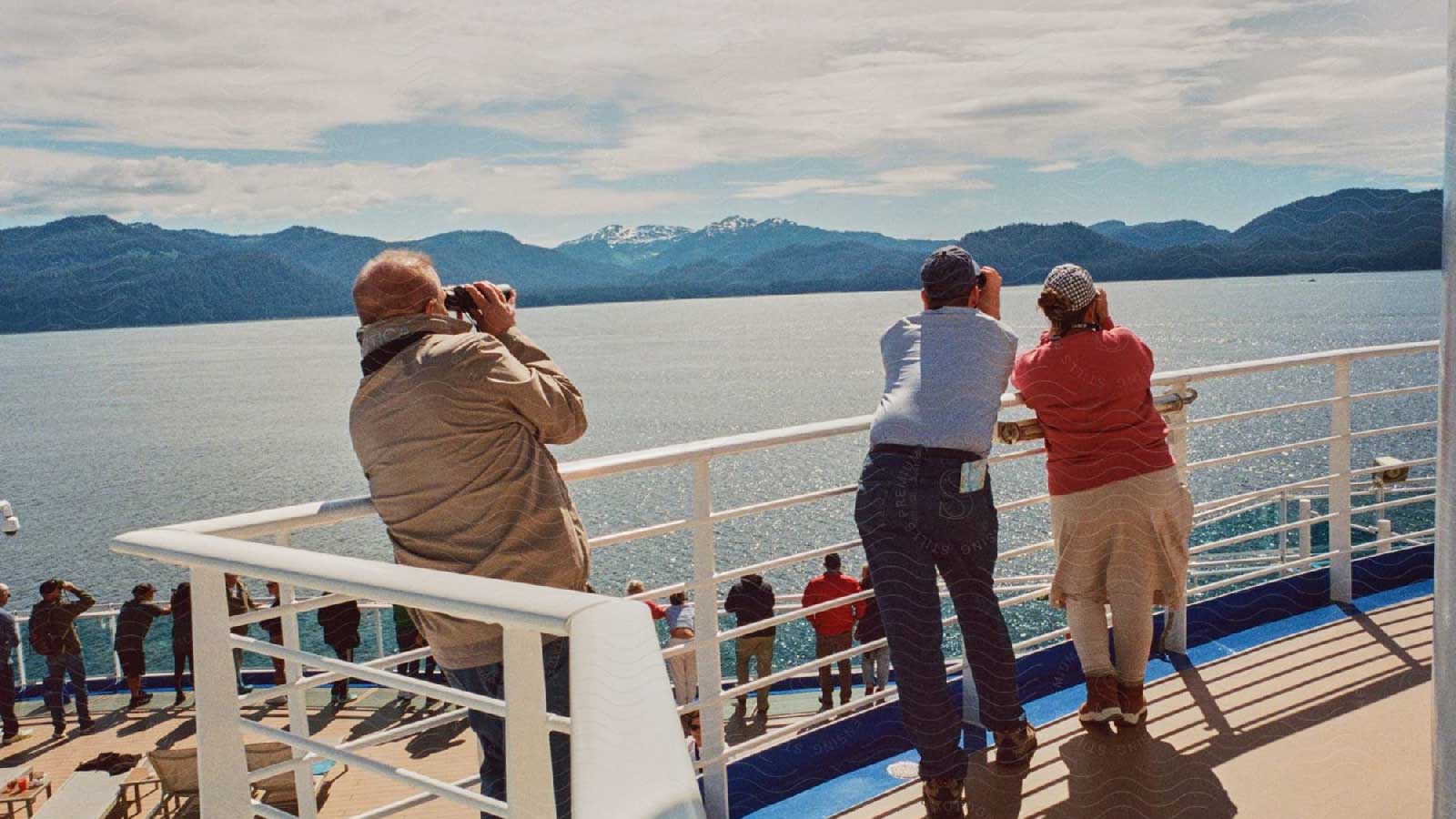 Some tourists on a deck of a ship