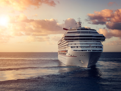 Large cruise ship on the ocean at sunset