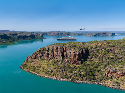 A crusie ship and a helicopter on the coast of the Kimberleys