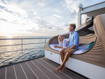 A couple on the deck of a Cruise to the Whitsundays
