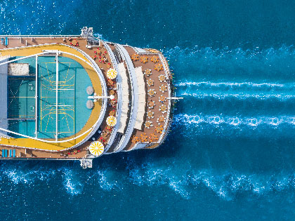 Aerial view of  a ship and its wake in the water