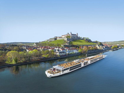 Cruise ship passing an old European town