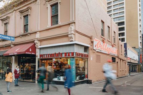 People walking outside Pellegrini's bar in Melbourne CBD