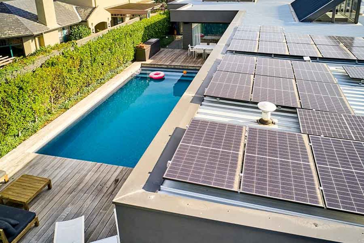 large house with solar panels installed on its roof