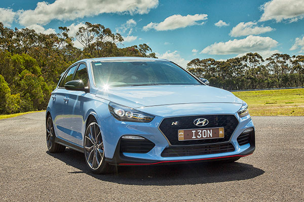  Mid-blue Hyundai i30 N Performance parked on test circuit in sun