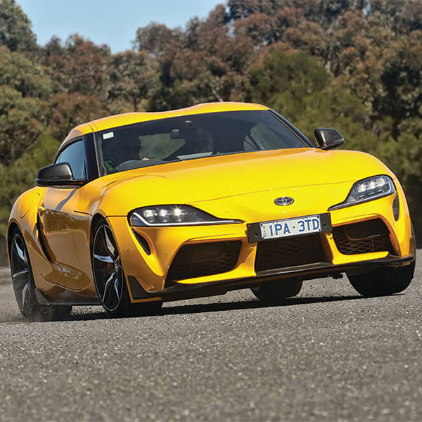 Yellow Toyota Supra GTS on testing circuit