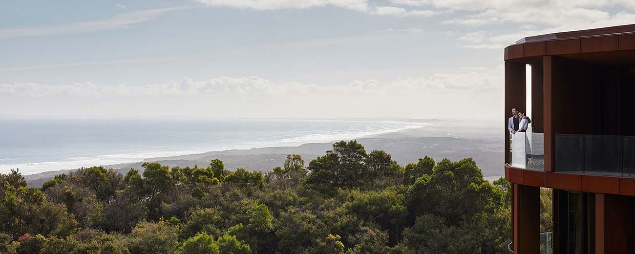 Couple at a balcony at the RACV Cape Schanck Resort overlooking the view of the bay